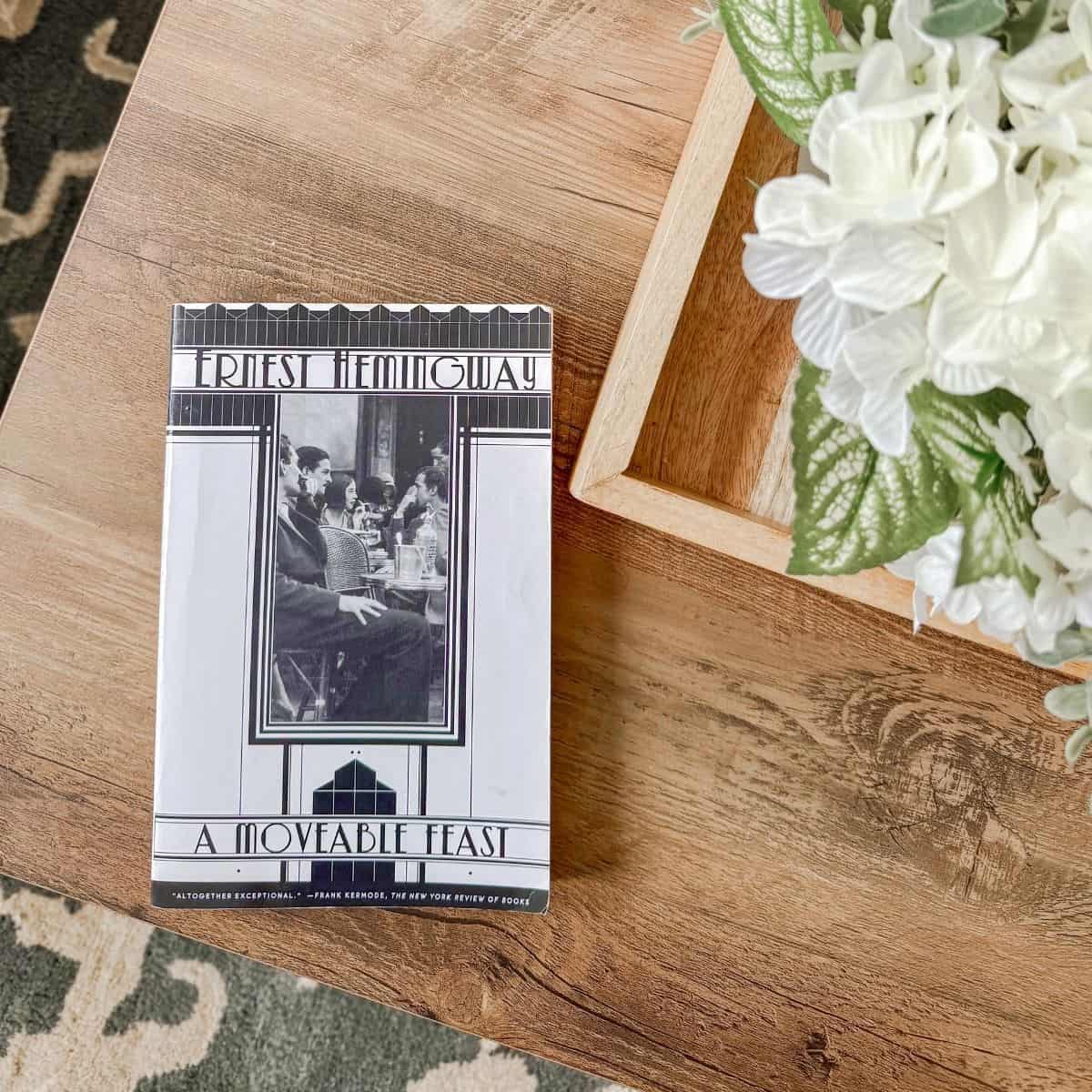 a moveable feast by ernest hemingway on a coffee table.