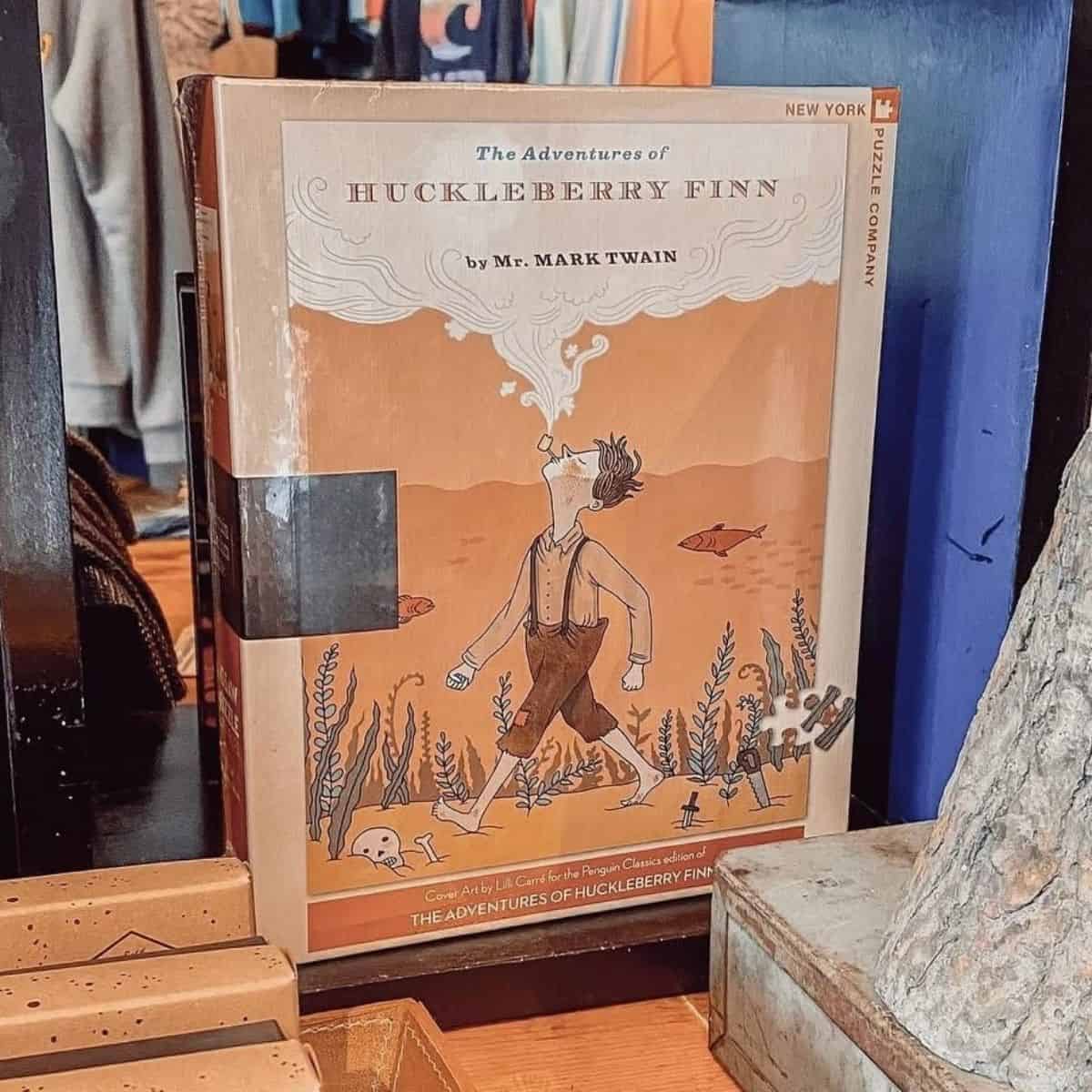 The Adventures of Huckleberry Finn by Mark Twain.